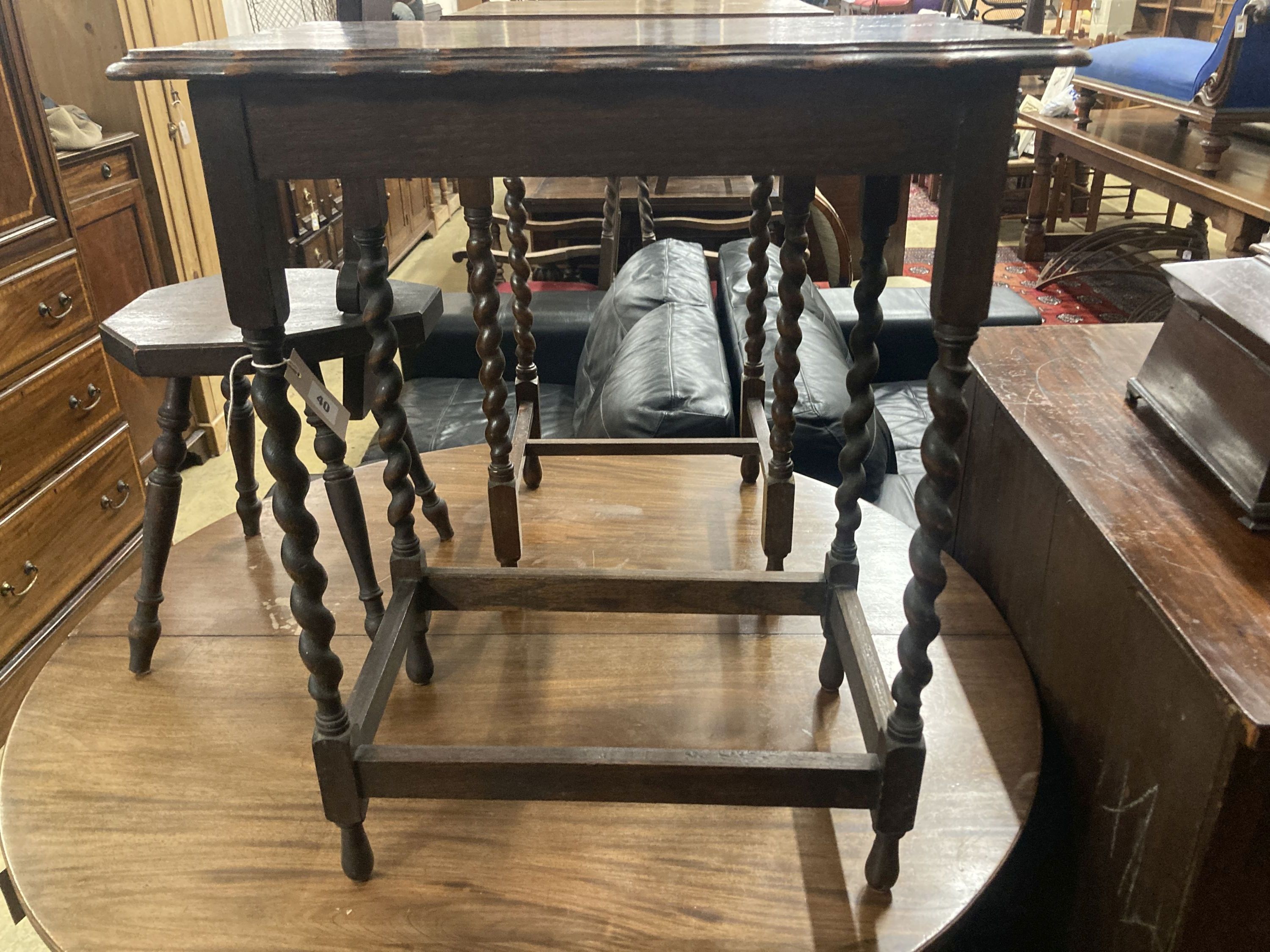 Two 1920s oak occasional tables, larger width 60cm, depth 37cm, height 72cm, together with a carved oak spinning chair